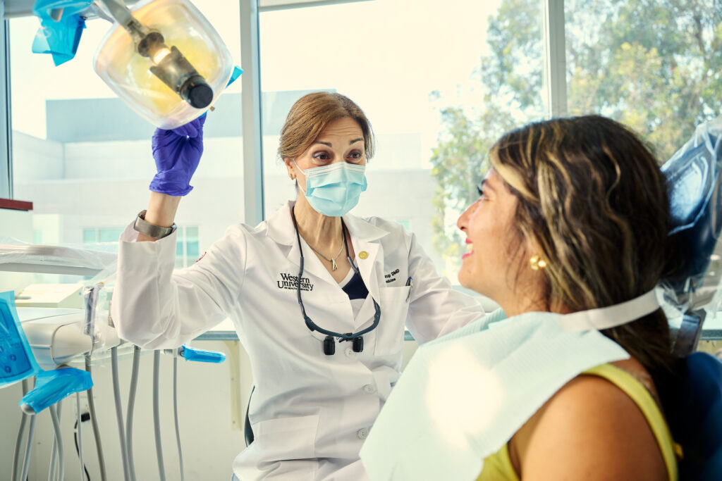 A female patient talking to a female dentist in the dental center