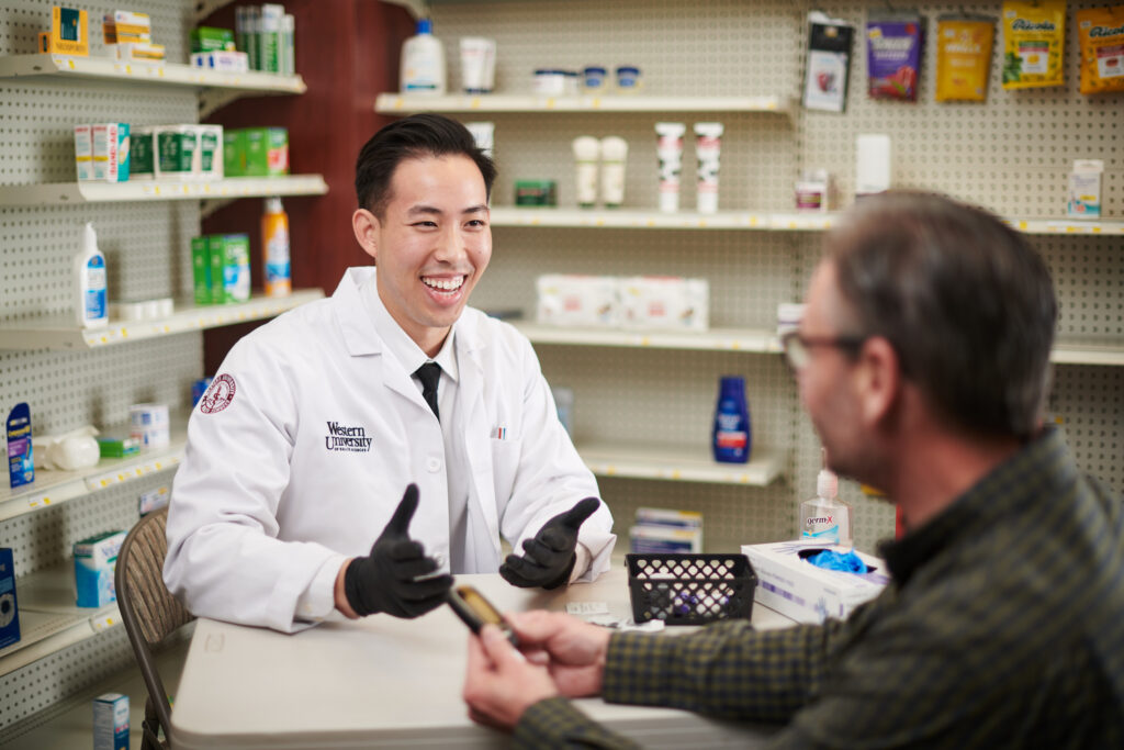 student pharmacists and faculty giving a consultation and treating patients